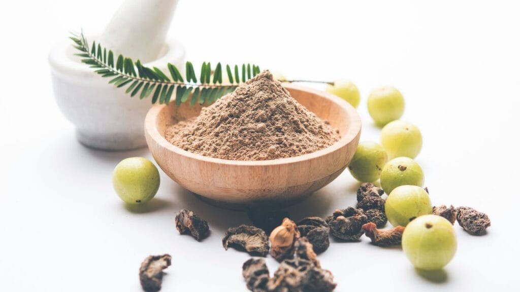 Fresh Indian Gooseberry Amla fruit used in Ahimsa natural shampoo for scalp recovery and hair growth.